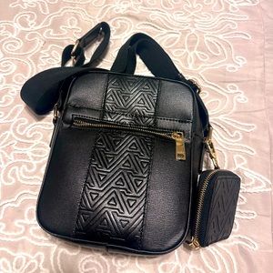 Next to new black and gold Aldo cross bag